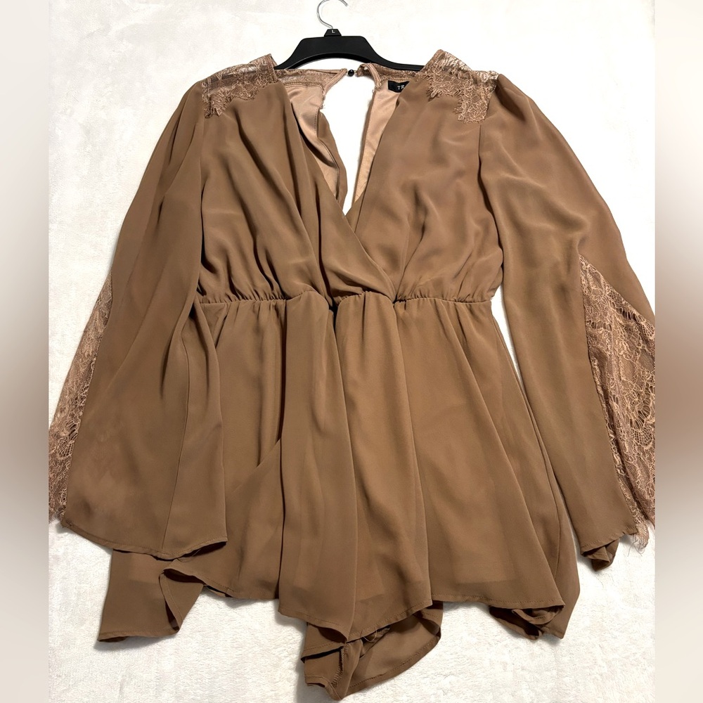 Light brown flowy romper with lace details